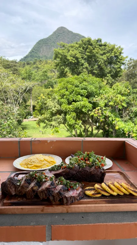 Country barbecue lunch served on private terrace facing Cerro Tusa