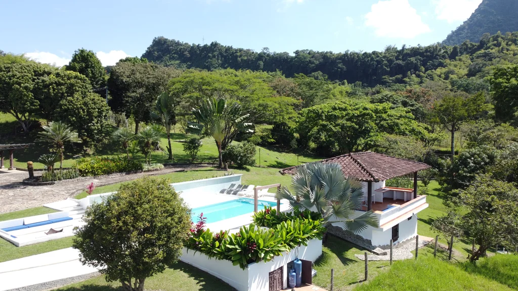 Countryside swimming pool under sunshine with mountain vistas in traditional Venecia finca